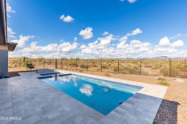 view of swimming pool with a patio area, a fenced backyard, a fenced in pool, and a jacuzzi