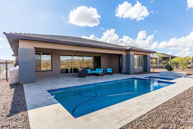 view of pool with an in ground hot tub, a patio area, fence, and an outdoor living space