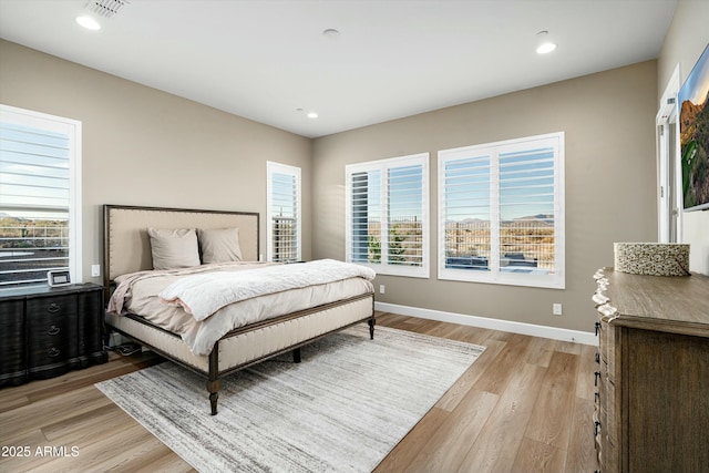 bedroom with visible vents, recessed lighting, light wood-style flooring, and baseboards