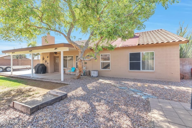 6102 W Shangri La Rd, Glendale, AZ 85304 - rear view of property with a patio, stucco siding, a chimney, a ceiling fan, and a tile roof