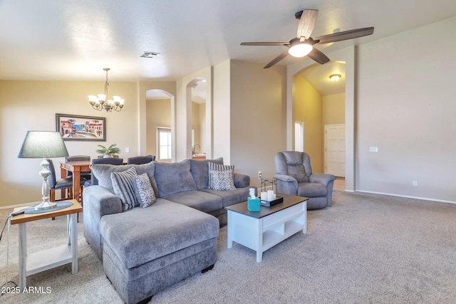 6102 W Shangri La Rd, Glendale, AZ 85304 - living room featuring visible vents, light carpet, baseboards, arched walkways, and ceiling fan with notable chandelier