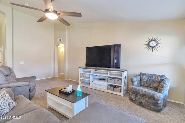 6102 W Shangri La Rd, Glendale, AZ 85304 - carpeted living room with a ceiling fan, visible vents, arched walkways, vaulted ceiling, and baseboards