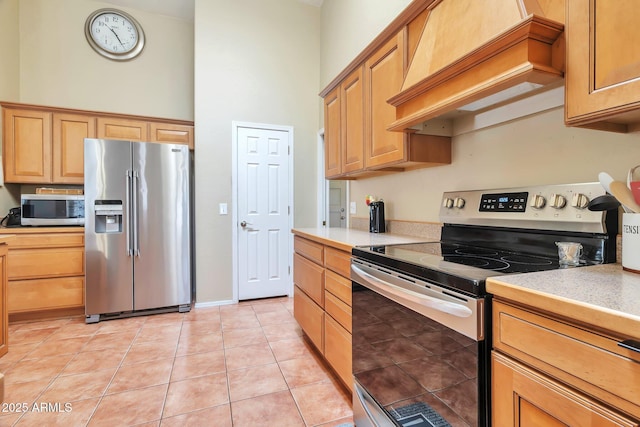 6102 W Shangri La Rd, Glendale, AZ 85304 - kitchen with light countertops, appliances with stainless steel finishes, a high ceiling, and custom exhaust hood