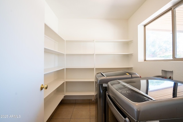8055 W Sanna St, Peoria, AZ 85345 - washroom with washing machine and clothes dryer and light tile patterned flooring
