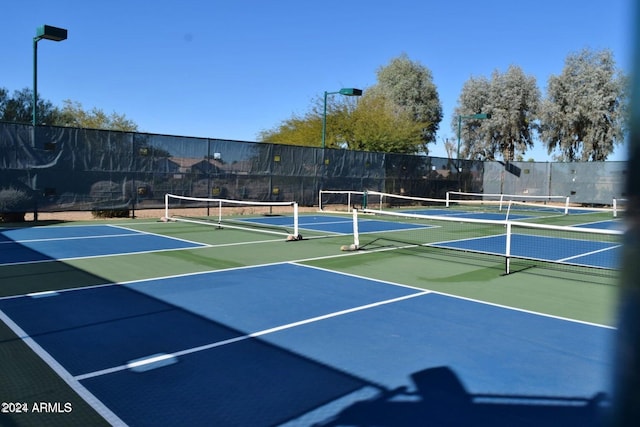 view of sport court with basketball hoop