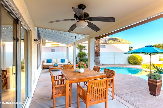 view of patio with outdoor lounge area and a fenced in pool