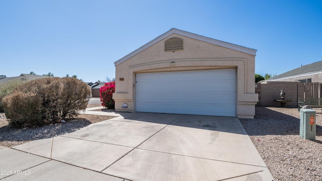 garage featuring fence