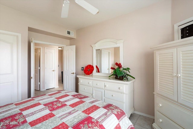 tiled bedroom with ceiling fan