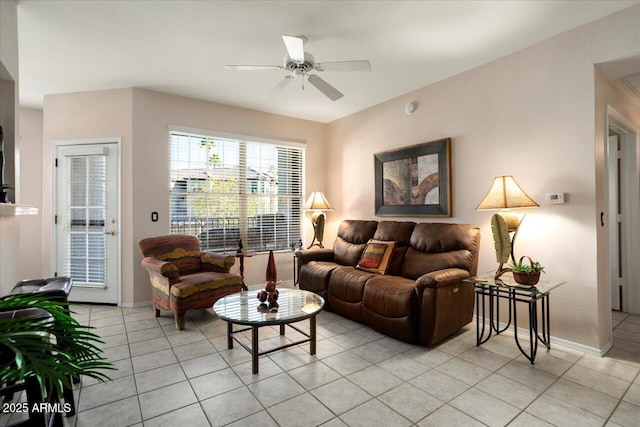 tiled living room featuring ceiling fan