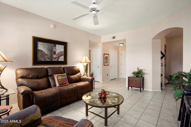 living room with ceiling fan and light tile patterned flooring