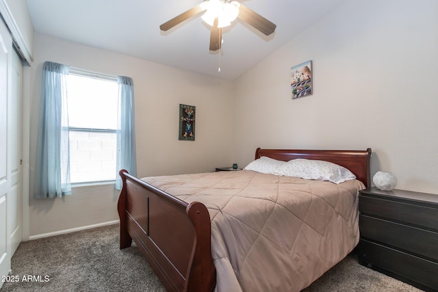 bedroom featuring baseboards, carpet, lofted ceiling, a closet, and a ceiling fan