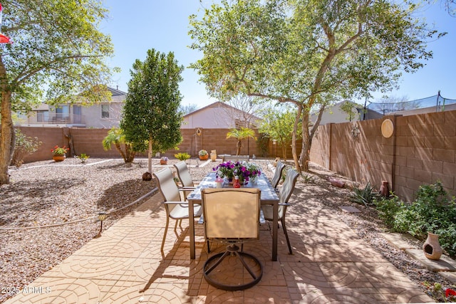 view of patio / terrace with outdoor dining area and a fenced backyard