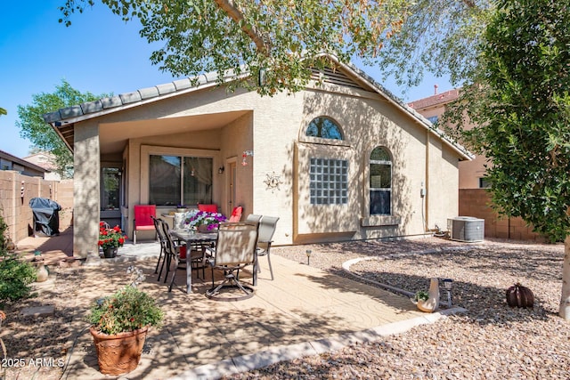 back of house featuring a patio area, stucco siding, cooling unit, and fence