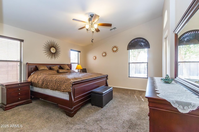 bedroom featuring visible vents, ceiling fan, baseboards, and carpet floors