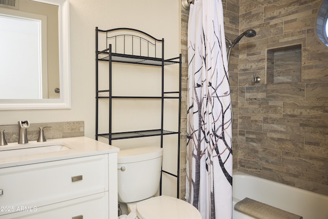 bathroom featuring shower / bathtub combination with curtain, vanity, and toilet