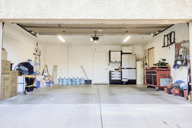garage featuring water heater and a garage door opener