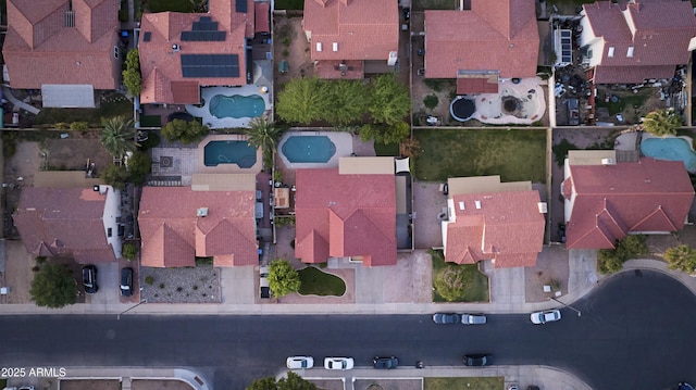 birds eye view of property with a residential view