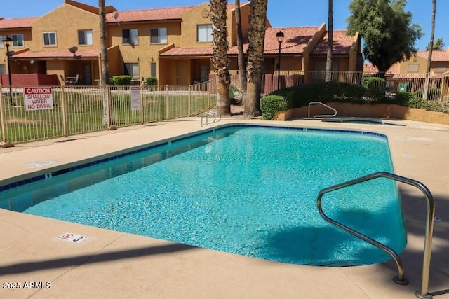 pool featuring fence