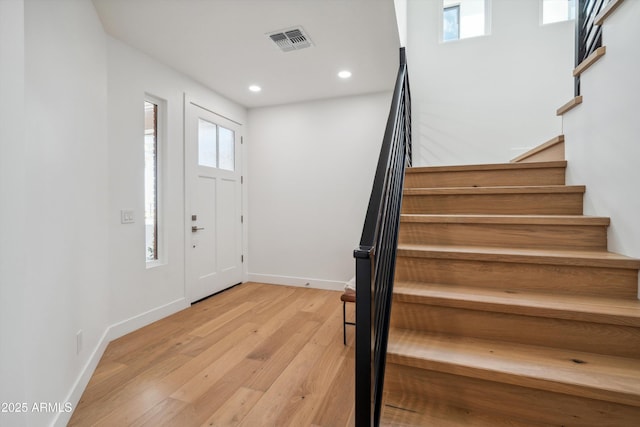 5537 E Earll Dr, Phoenix, AZ 85018 - entryway with light wood-style floors, stairs, recessed lighting, baseboards, and plenty of natural light
