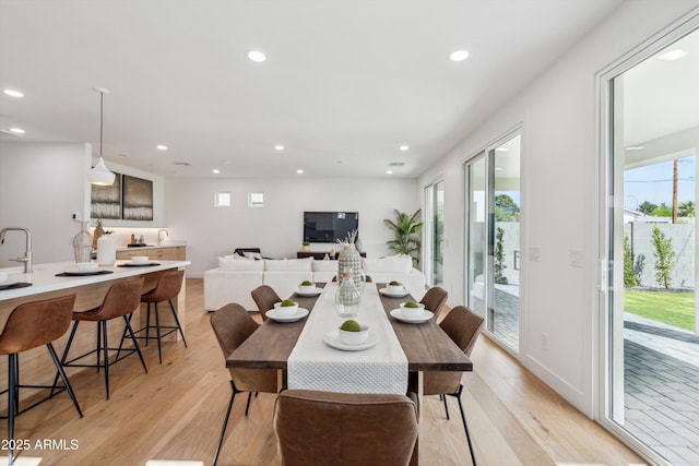 5537 E Earll Dr, Phoenix, AZ 85018 - dining area with light wood finished floors, recessed lighting, and plenty of natural light