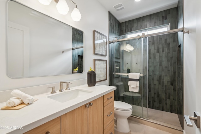 5537 E Earll Dr, Phoenix, AZ 85018 - bathroom with toilet, vanity, a stall shower, and tile patterned flooring