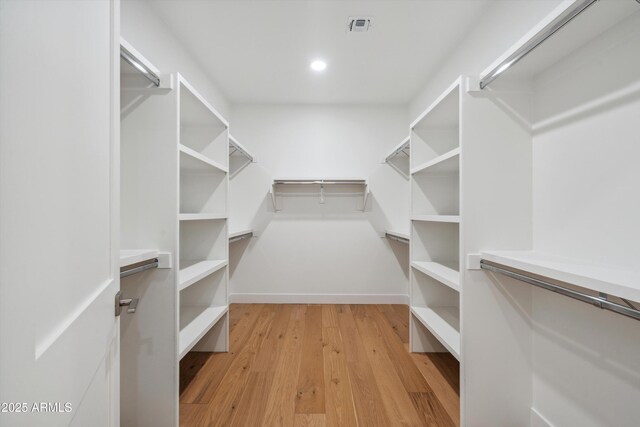 5537 E Earll Dr, Phoenix, AZ 85018 - spacious closet with light wood finished floors