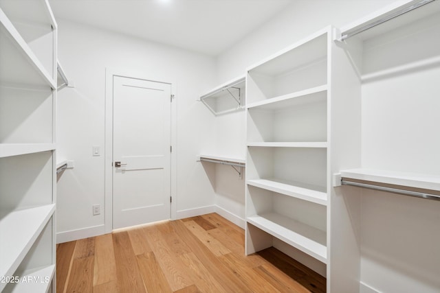5537 E Earll Dr, Phoenix, AZ 85018 - walk in closet featuring light wood finished floors