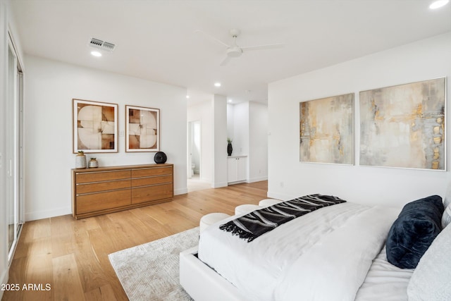 5537 E Earll Dr, Phoenix, AZ 85018 - bedroom with light wood-type flooring, recessed lighting, baseboards, ensuite bathroom, and ceiling fan