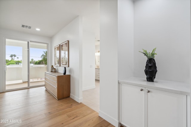 5537 E Earll Dr, Phoenix, AZ 85018 - hallway with light wood finished floors, baseboards, and recessed lighting