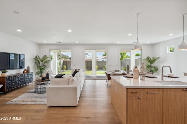 5537 E Earll Dr, Phoenix, AZ 85018 - living area with light wood finished floors and recessed lighting