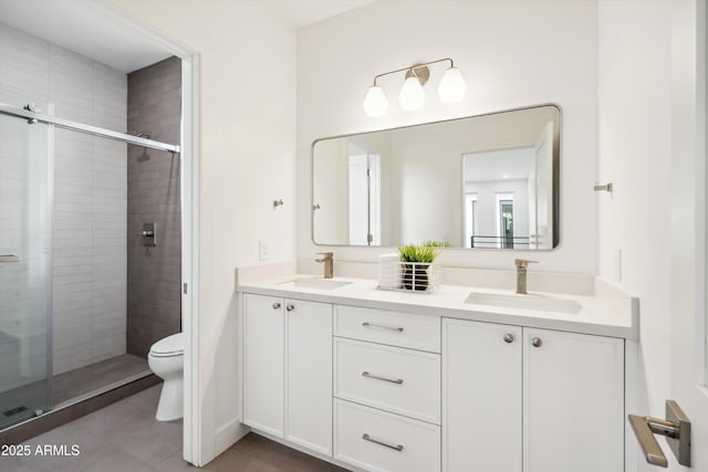 5537 E Earll Dr, Phoenix, AZ 85018 - full bath featuring a stall shower, toilet, double vanity, and tile patterned flooring