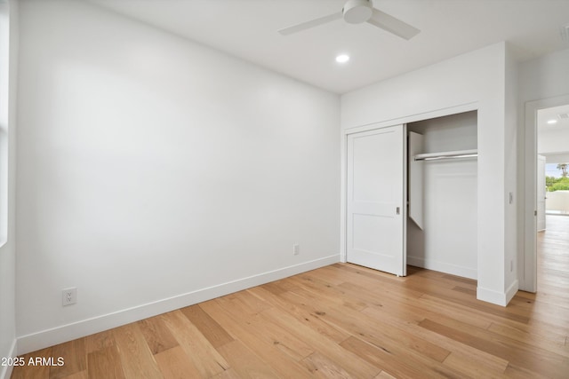 5537 E Earll Dr, Phoenix, AZ 85018 - unfurnished bedroom with light wood-style floors, baseboards, a closet, recessed lighting, and a ceiling fan