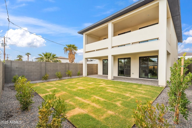 5537 E Earll Dr, Phoenix, AZ 85018 - rear view of property featuring a balcony, stucco siding, and a patio area