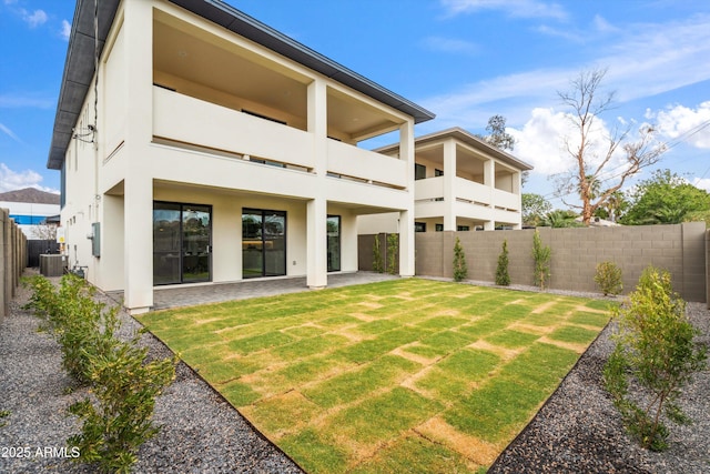 5537 E Earll Dr, Phoenix, AZ 85018 - rear view of property with a balcony, stucco siding, a patio, and central air condition unit