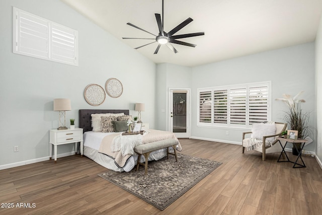 bedroom with lofted ceiling, hardwood / wood-style floors, and ceiling fan