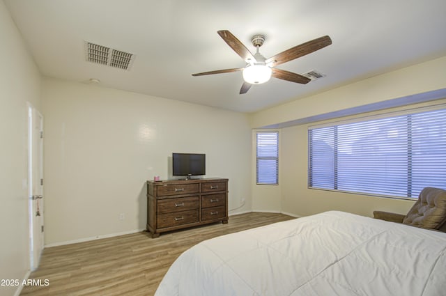 bedroom featuring ceiling fan and light hardwood / wood-style floors