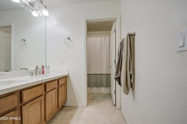 bathroom featuring vanity and a notable chandelier