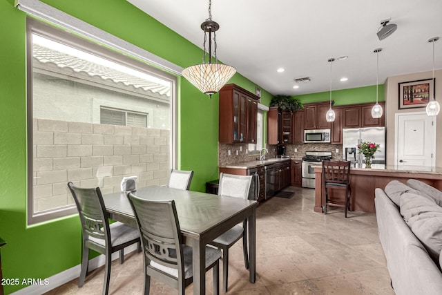 dining room featuring sink