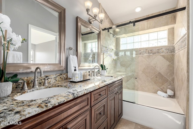 bathroom featuring tile patterned flooring, vanity, and shower / bath combination with glass door