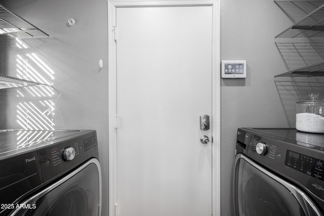 laundry room with washing machine and dryer