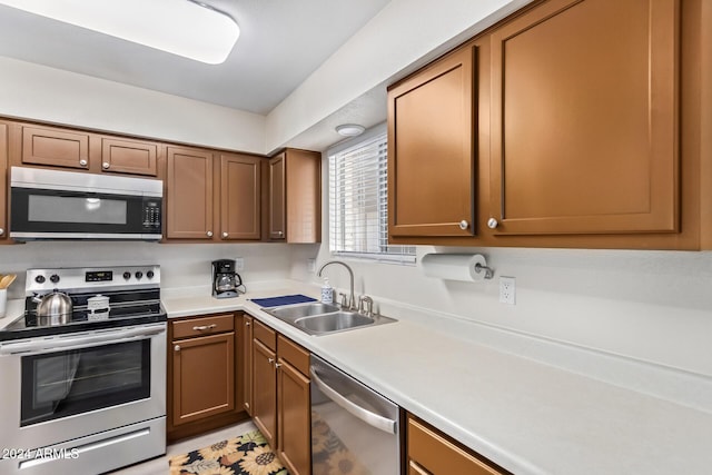 kitchen with appliances with stainless steel finishes and sink