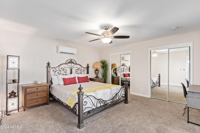 bedroom featuring multiple closets, ceiling fan, carpet flooring, and an AC wall unit