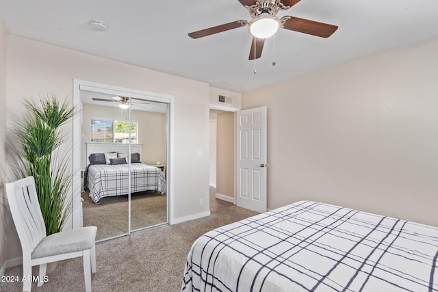 carpeted bedroom with ceiling fan and a closet