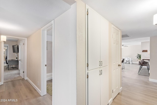 hallway featuring light hardwood / wood-style flooring