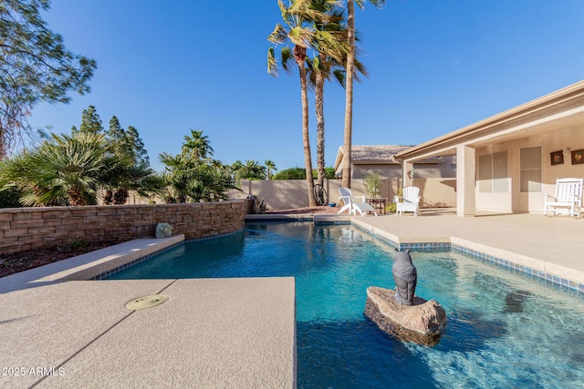 view of pool featuring a patio area, a fenced backyard, and a fenced in pool