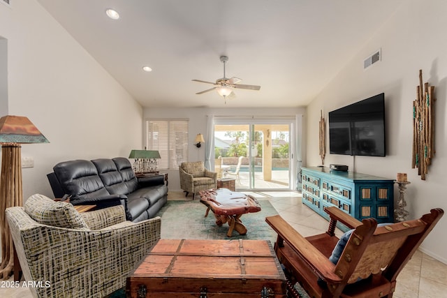 living area with lofted ceiling, recessed lighting, visible vents, a ceiling fan, and light tile patterned flooring