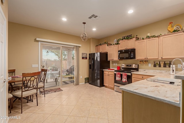 kitchen featuring decorative light fixtures, sink, light brown cabinets, and black appliances