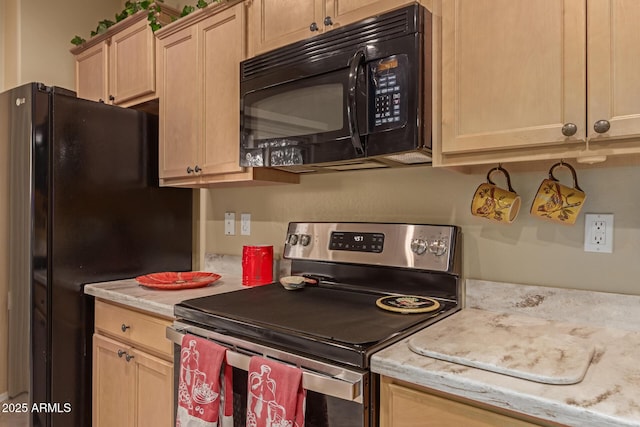 kitchen featuring light brown cabinetry and black appliances