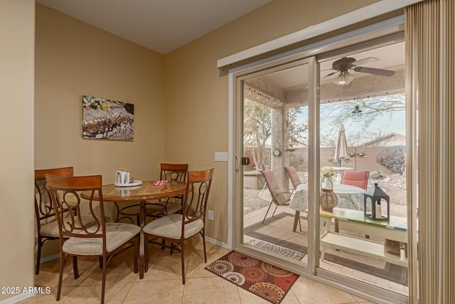 dining area featuring ceiling fan, light tile patterned floors, and a healthy amount of sunlight