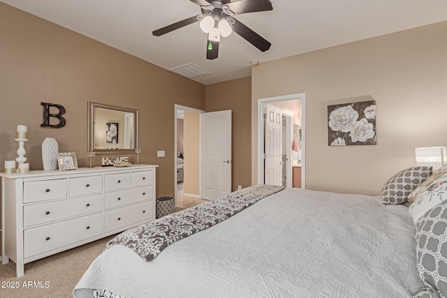 bedroom featuring ceiling fan and connected bathroom